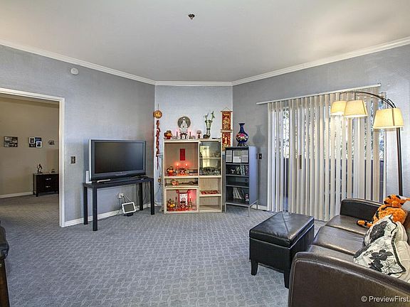 Family room with fire place. Fire place is located behind cabinets and not shown in this picture.