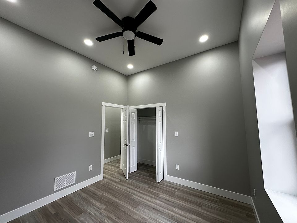First bedroom across from kitchen:
10'11" x 10' 10"