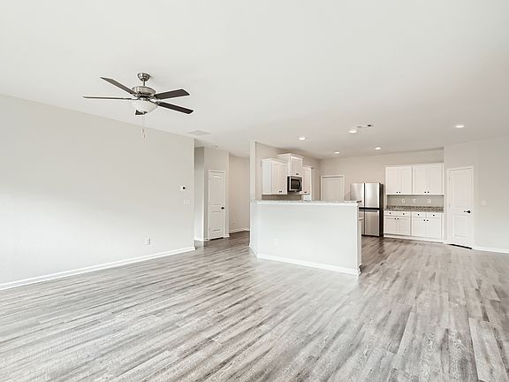 Large living area with an open-concept layout that creates the perfect space for hosting.