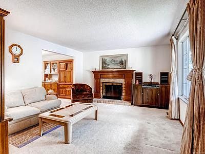 Family room with new carpet  and Fireplace #2.