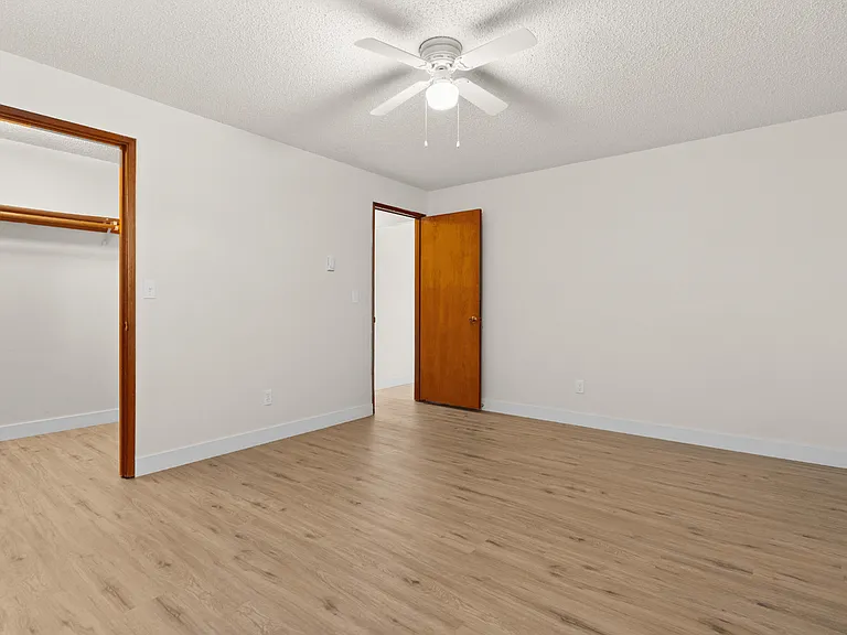 Bright bedroom with generous closet storage in a one-bedroom deluxe apartment at Palisades Apartments in Tacoma. Bright bedroom with generous closet storage in a one-bedroom deluxe apartment at Palisades Apartments in Tacoma.