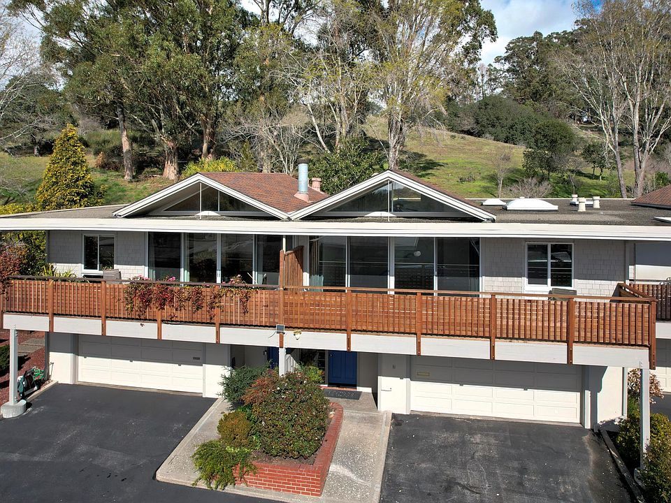 Drone view of the condo and the back open space