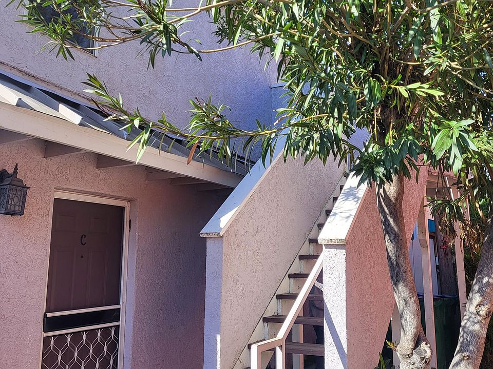 Apartment # D is located upstairs in the back.