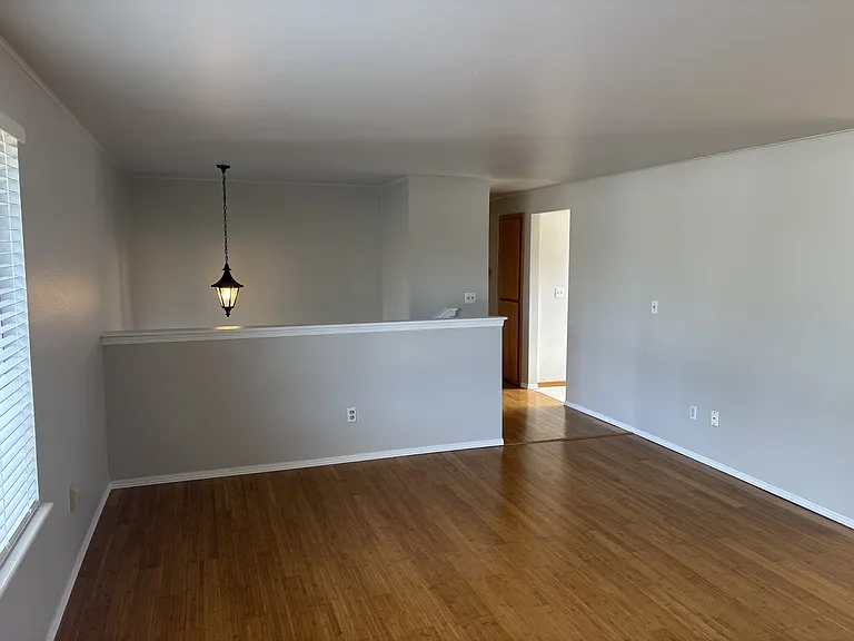 Living room facing the stairs and hallway