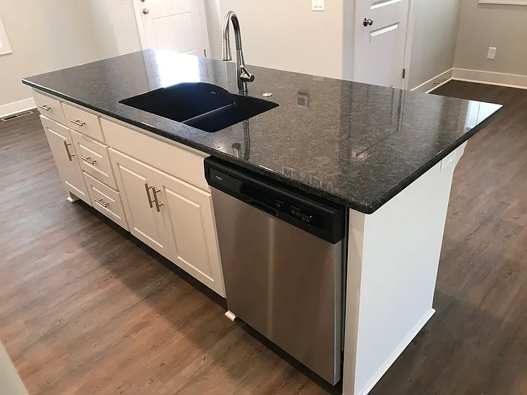 Kitchen island with overhang for bar stools.