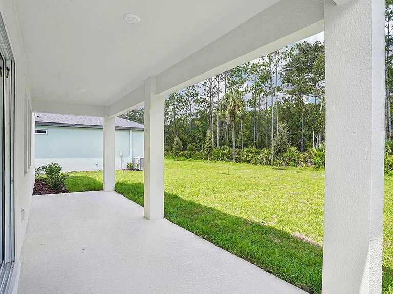 Extended covered patio with overhead lights. 24' long.
