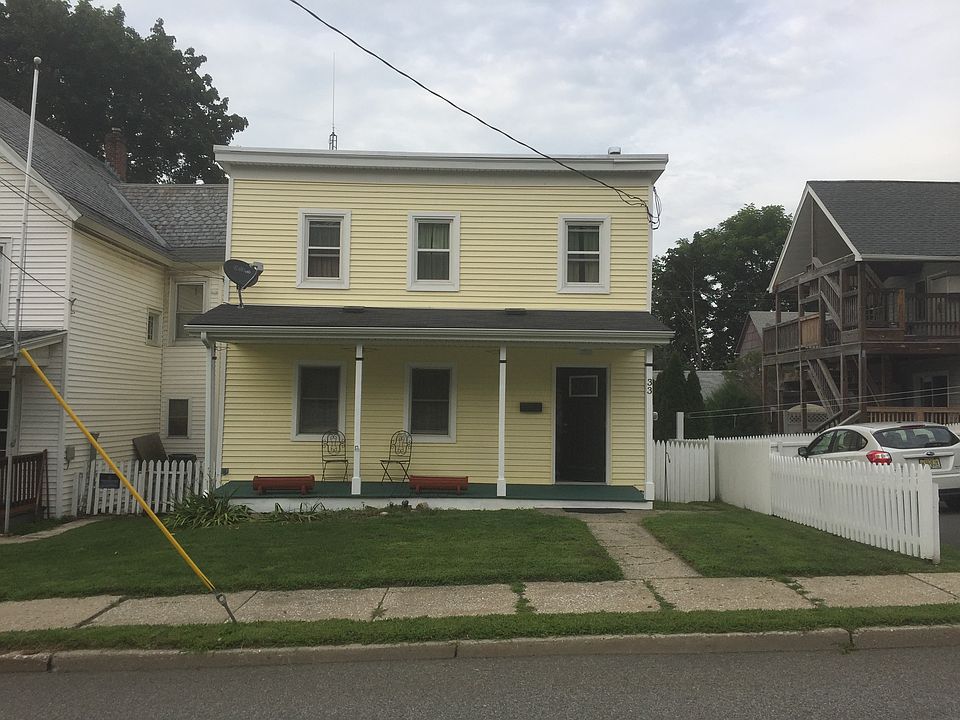 Yellow colonial style house 