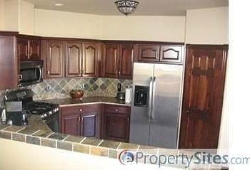 This dynamo-kitchen has new granite, stainless steel appliances, etc.