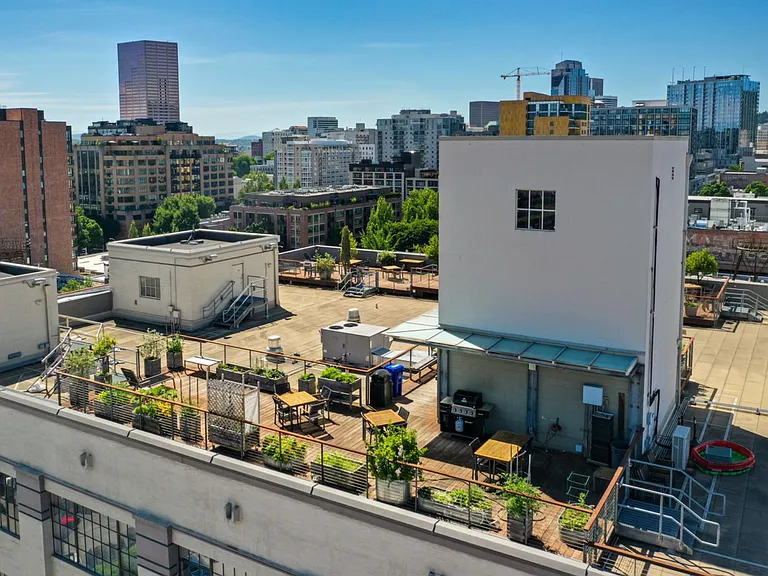 Rooftop patio with barbeque grills and 360 degree views