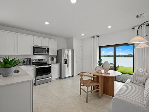 Naturally lit dining area that flows from the kitchen