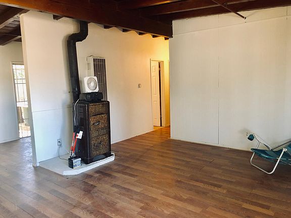 Living room new hardwood floors Wall heater Air cooler