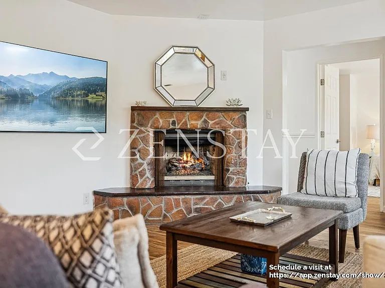 Open Living Room with Gas Fireplace and Smart TV