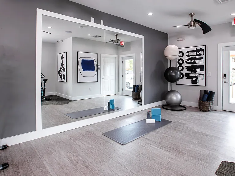 Find your zen in the dedicated yoga and stretching area in our fitness center. Complete with a full-length mirror, yoga mats, and exercise balls, this space is perfect for stretching, yoga, or a peaceful cooldown after your workout.