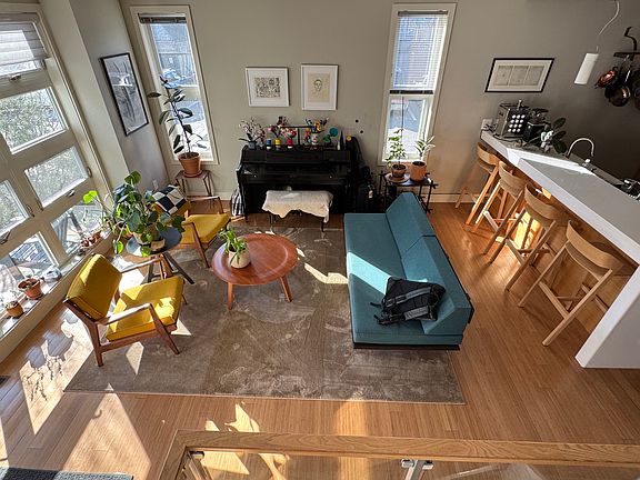 open concept living room with piano