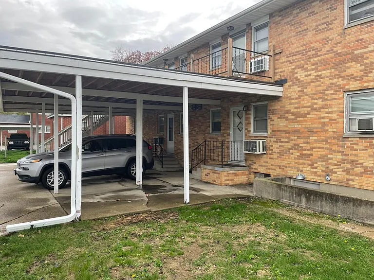 One space assigned for tenant #3 with additional on street parking. Notice shared upper deck in rear of building.