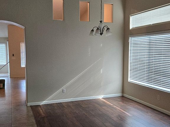 living-room view from front door, kitchen/family room & master via the archway.