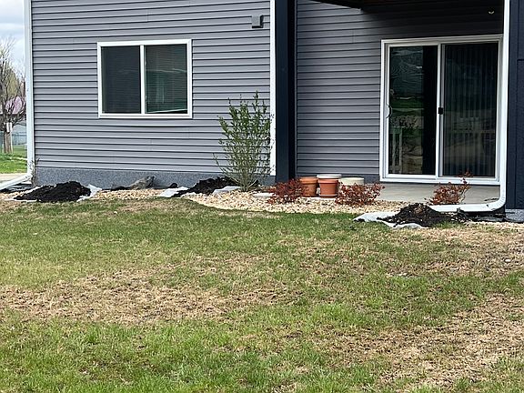 Lower level unit - current pictures reflects landscaping that is being done.