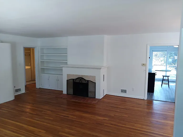 Living room showing entry into kitchen and hallway