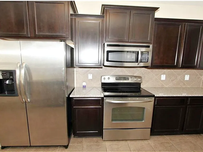 Kitchen all stainless steel appliances.