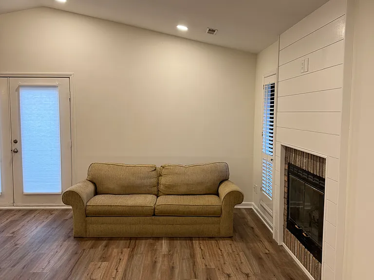 Large Liging room with Gas logs and modern lighting,