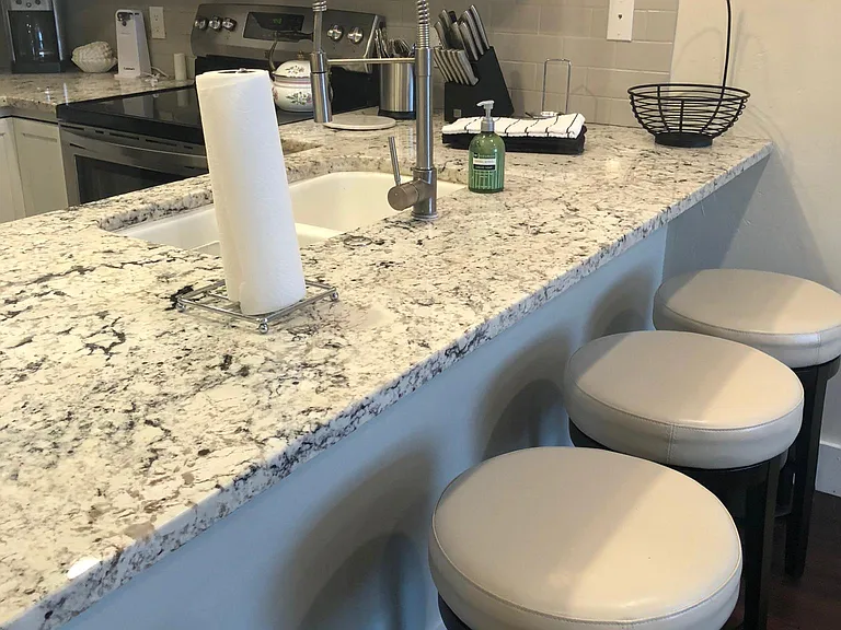 Kitchen with four bar stools