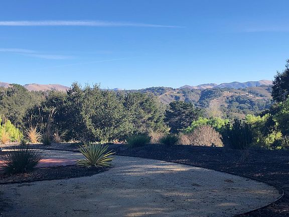 Decomposed granite area for outdoor dining table and entertaining space with view.