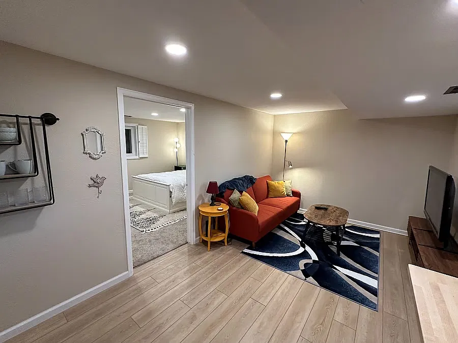 Living room and large bedroom view.