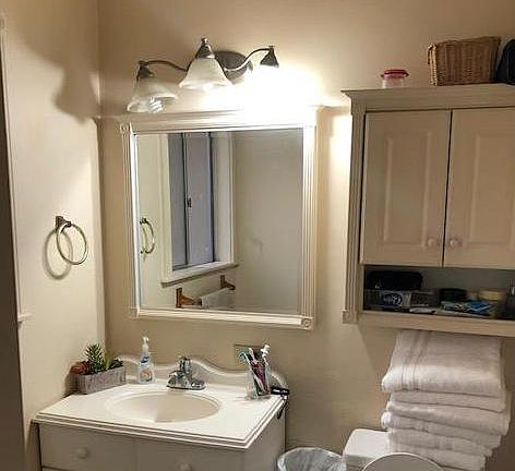 Shower behind Vanity. Walk in closet with separate entry behind bathroom.