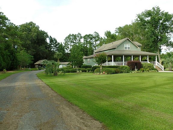 Beautifully manicured lawn and shrubs.