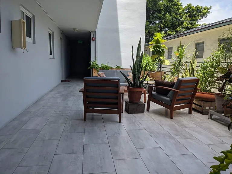 Deck in front of the apartment. The apt is the one showing in the picture (windows and door).