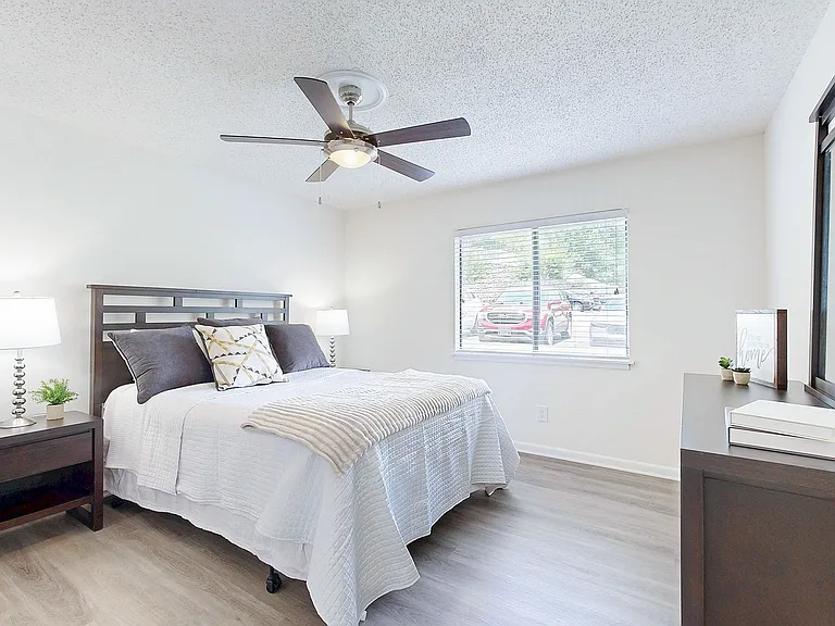 Bedroom with hardwood-style flooring & ceiling fan