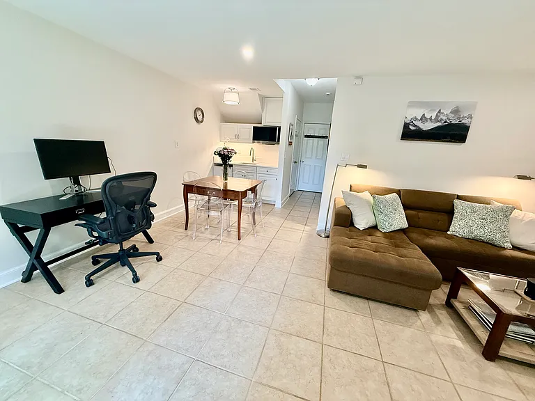 Studio includes workspace with TV monitor and work chair. Dining room table comes with four chairs.