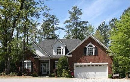 Traditional style home : Nestled in quiet cul-de-sac of gated Lake Murray community.