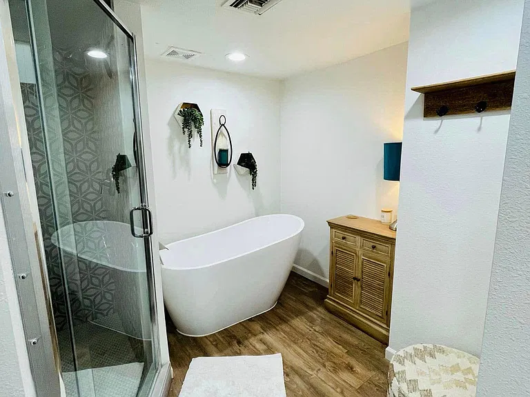Slipper tub in master bathroom. Cabinet and towel hook shelf in photo included.