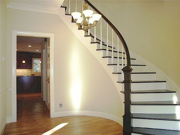Nice entrance foyer with a really neat curved staircase