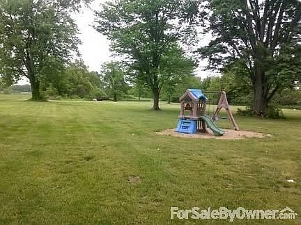 Huge back yard!
						:
						Underground electric dog fence wraps around front and back yards.