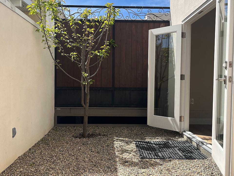 French doors to patio with pear tree