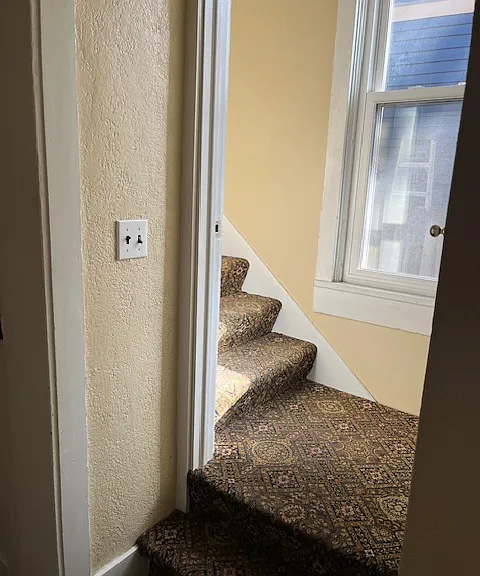 Stairwell leading to upstairs bedrooms