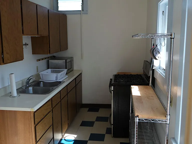 The kitchen is a galley that is adequate for meal preparation.