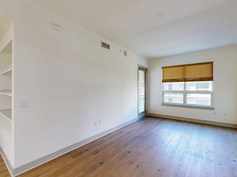 Apartment Living Room with Wood Style Flooring.