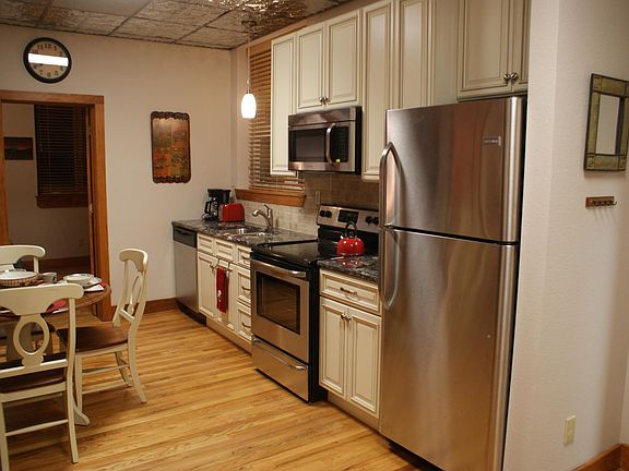 Kitchen furnished with pots, pans, utensils, etc.