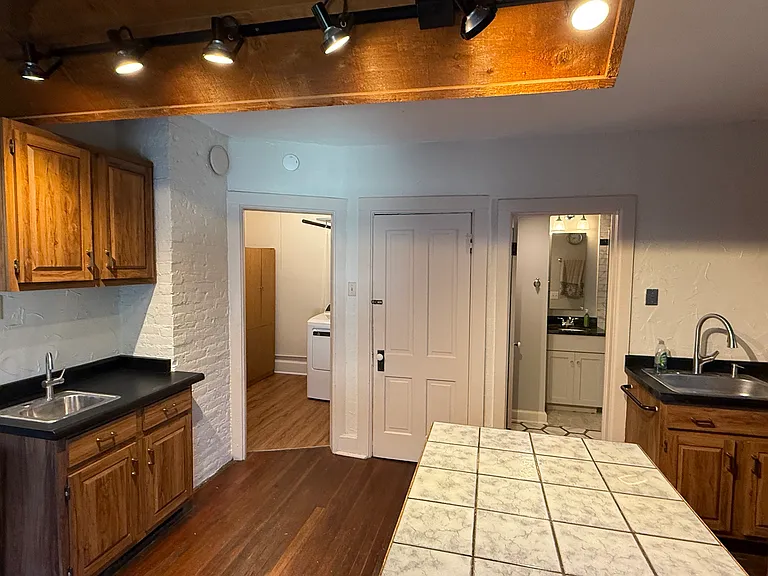 Large Kitchen and stair to backyard / garage