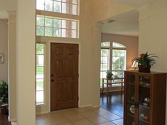 Foyer features larger upgraded tile installed on the diagonal.