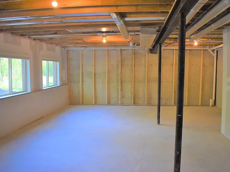 Expansive Unfinished Basement for Storage or Recreational Use