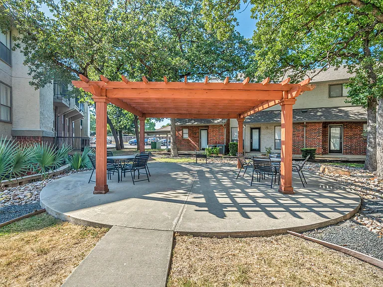 Pergola and seating area near pool
