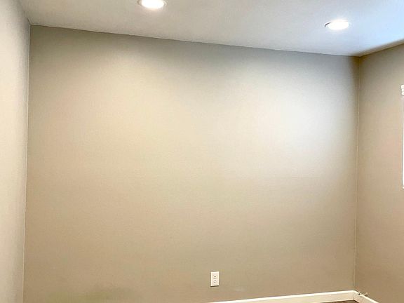 Bedroom with recessed lighting and mirrored wardrobe doors