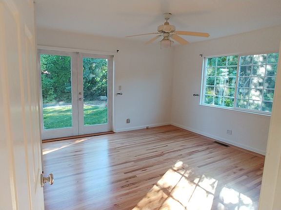 Large bedroom with french doors to backyard
