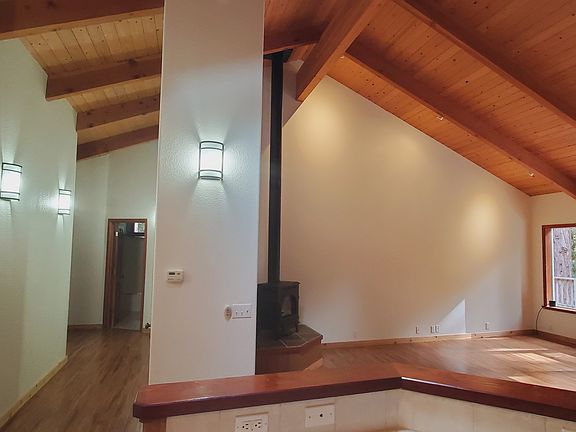 Hall to bedrooms on the left, great room on right, as seen from kitchen