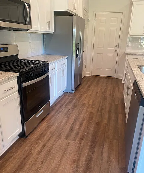 Kitchen View and Appliances
Door to Garage