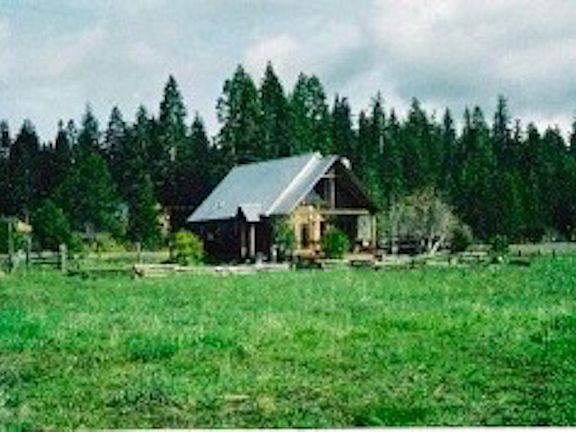 View of land with cabin